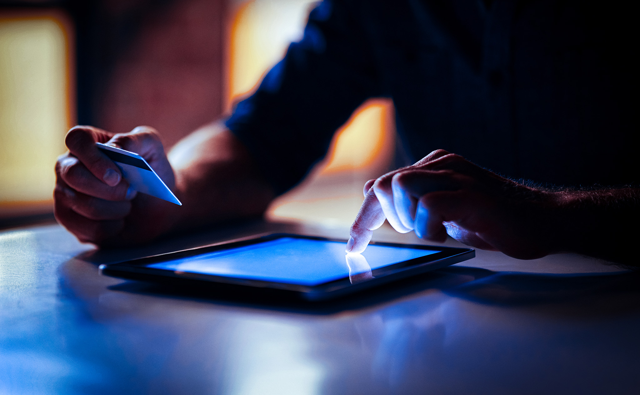 Photo of a person buying goods on a tablet