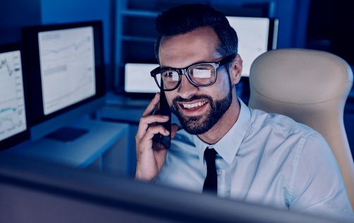 Happy young man talking on mobile phone