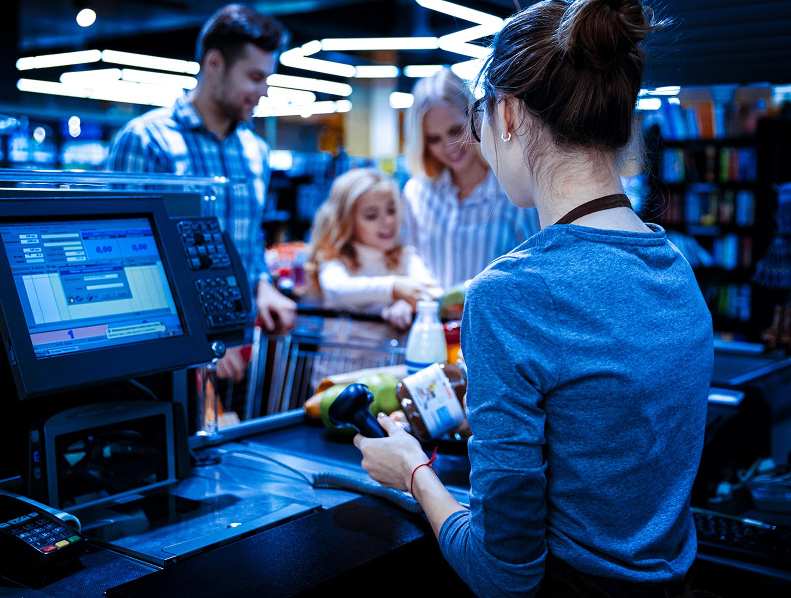 Image of people paying in a convenience store