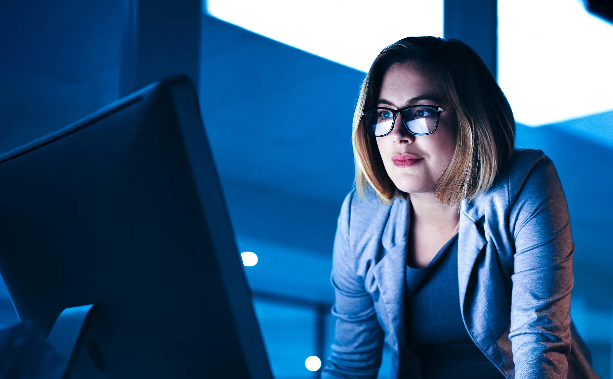 Photo of a woman working on her computer